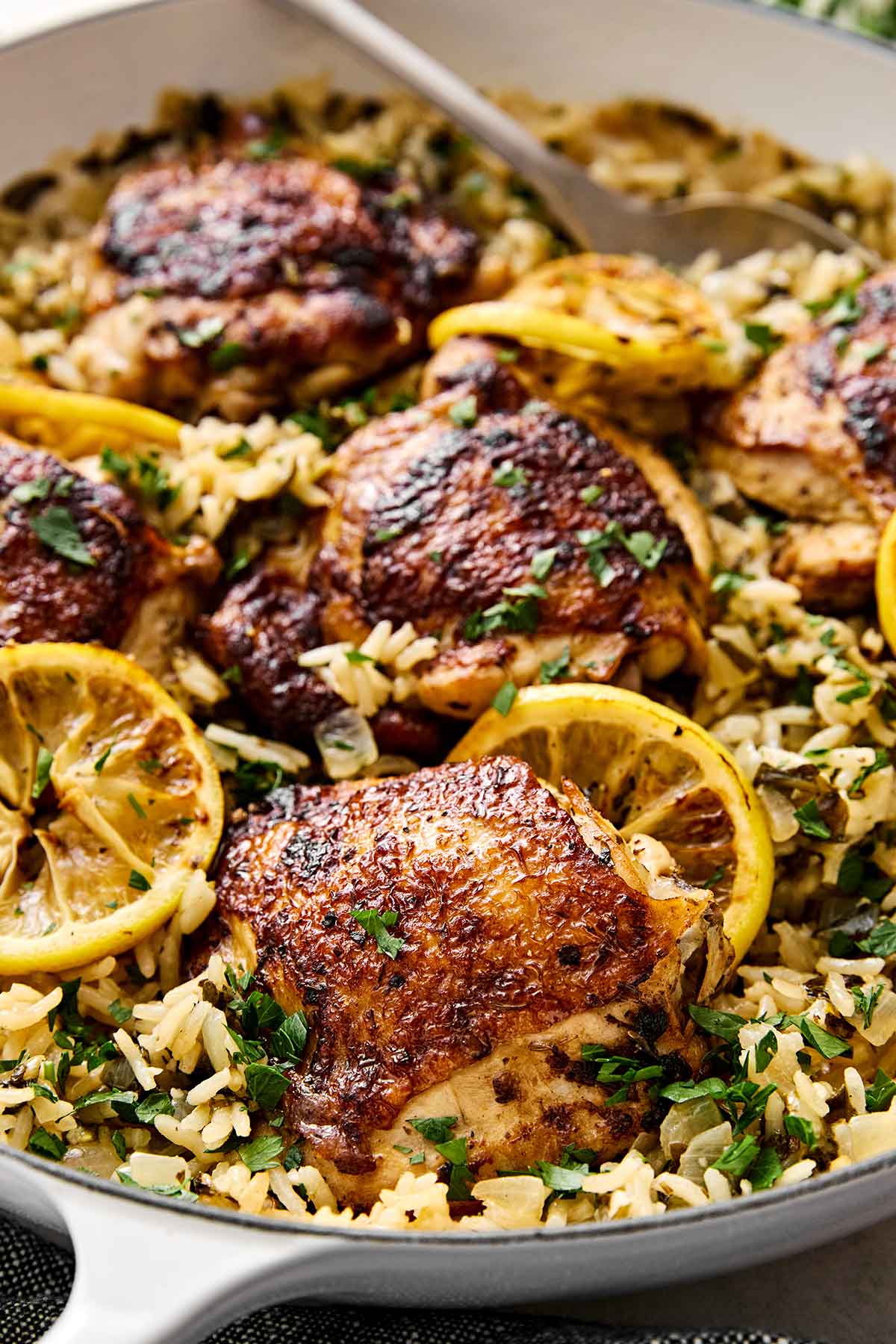 Chicken and rice with lemon slices.