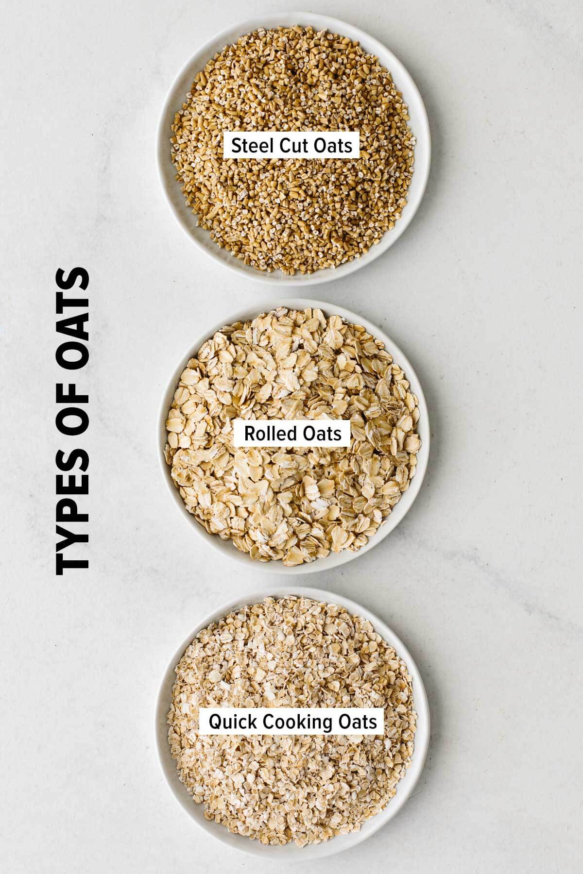 Small plates of steel cut oats, rolled oats, and quick cooking oats on a table.