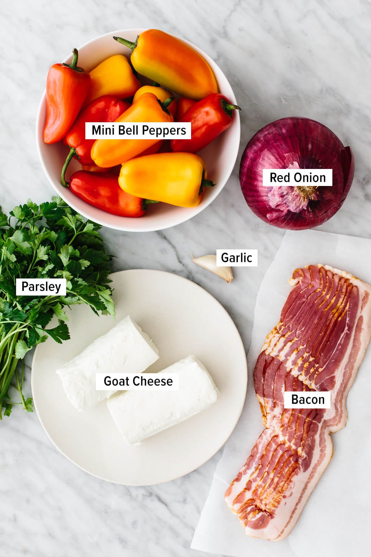 Bacon goat cheese stuffed mini pepper ingredients on a table.