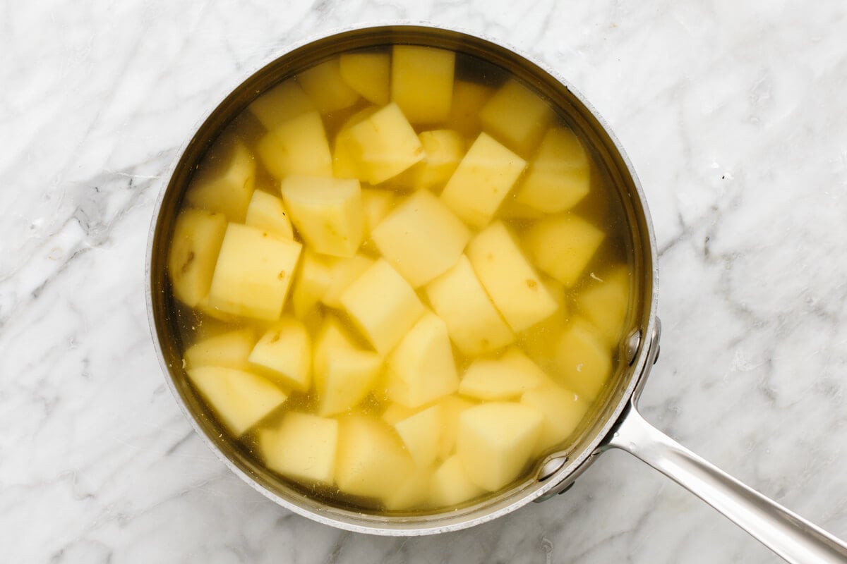 Boiling potatoes in a pot for colcannon.
