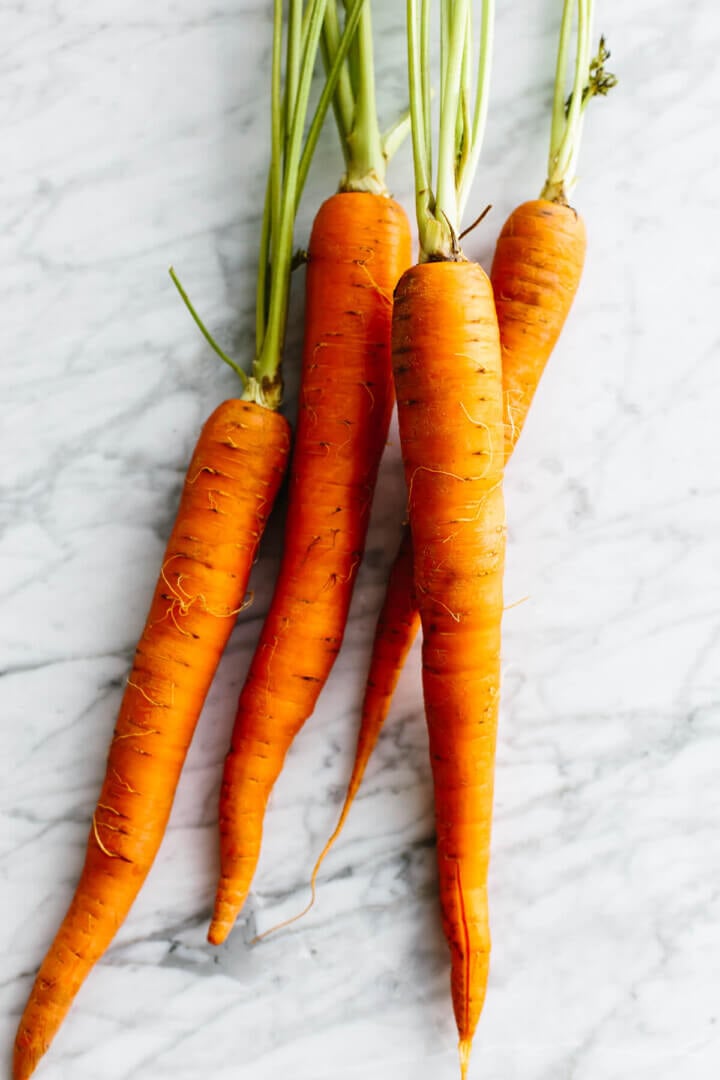 Carrots on a table for carrot cake.