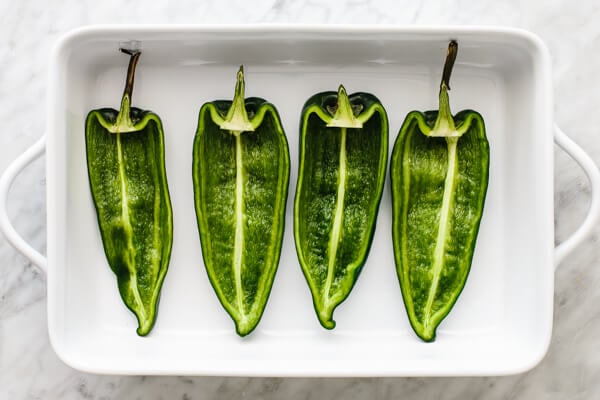 Roasted poblano peppers for carnitas stuffed poblano peppers.