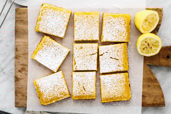 Lemon bar slices on a board.