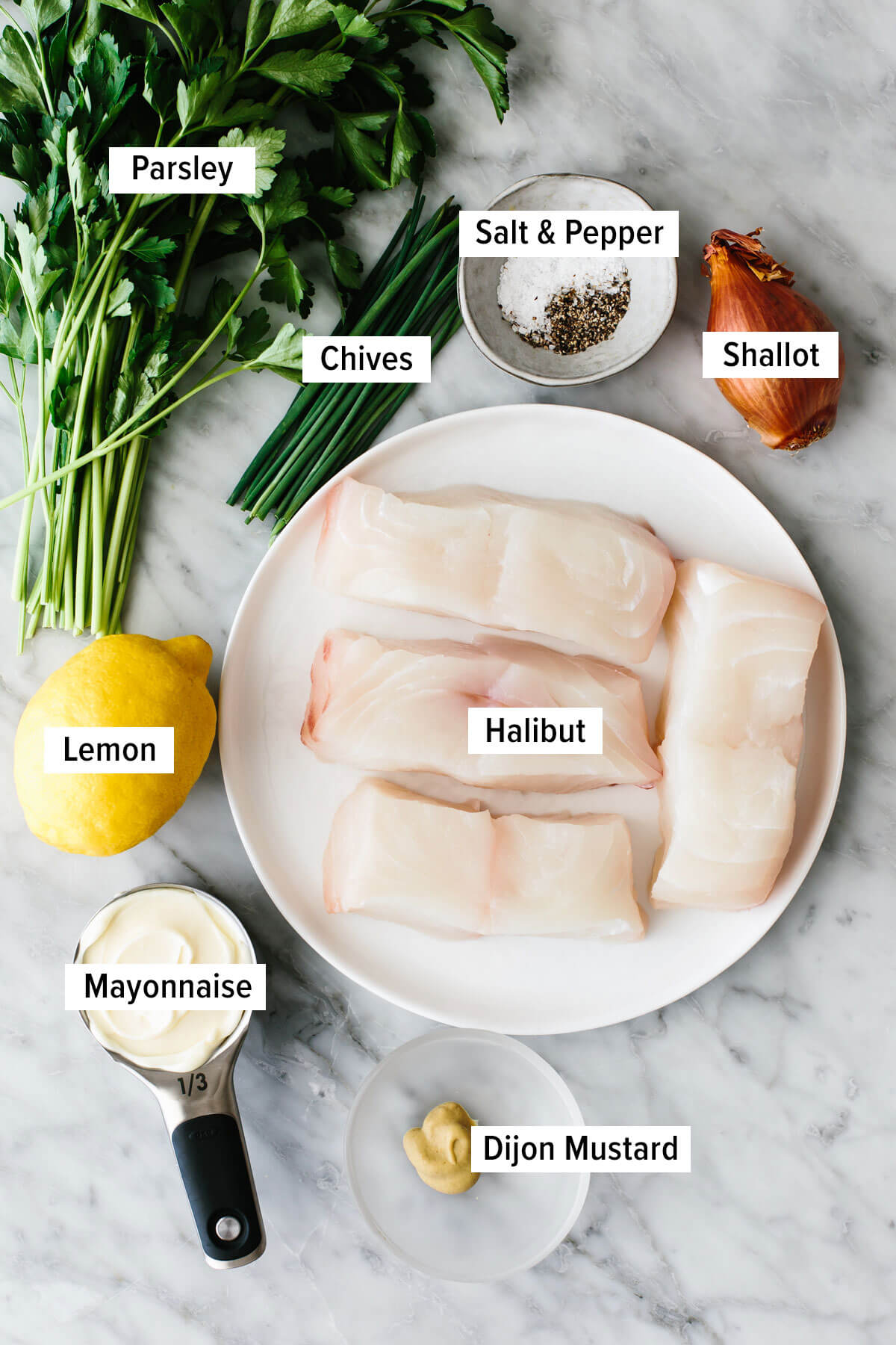 Ingredients for baked halibut on a table