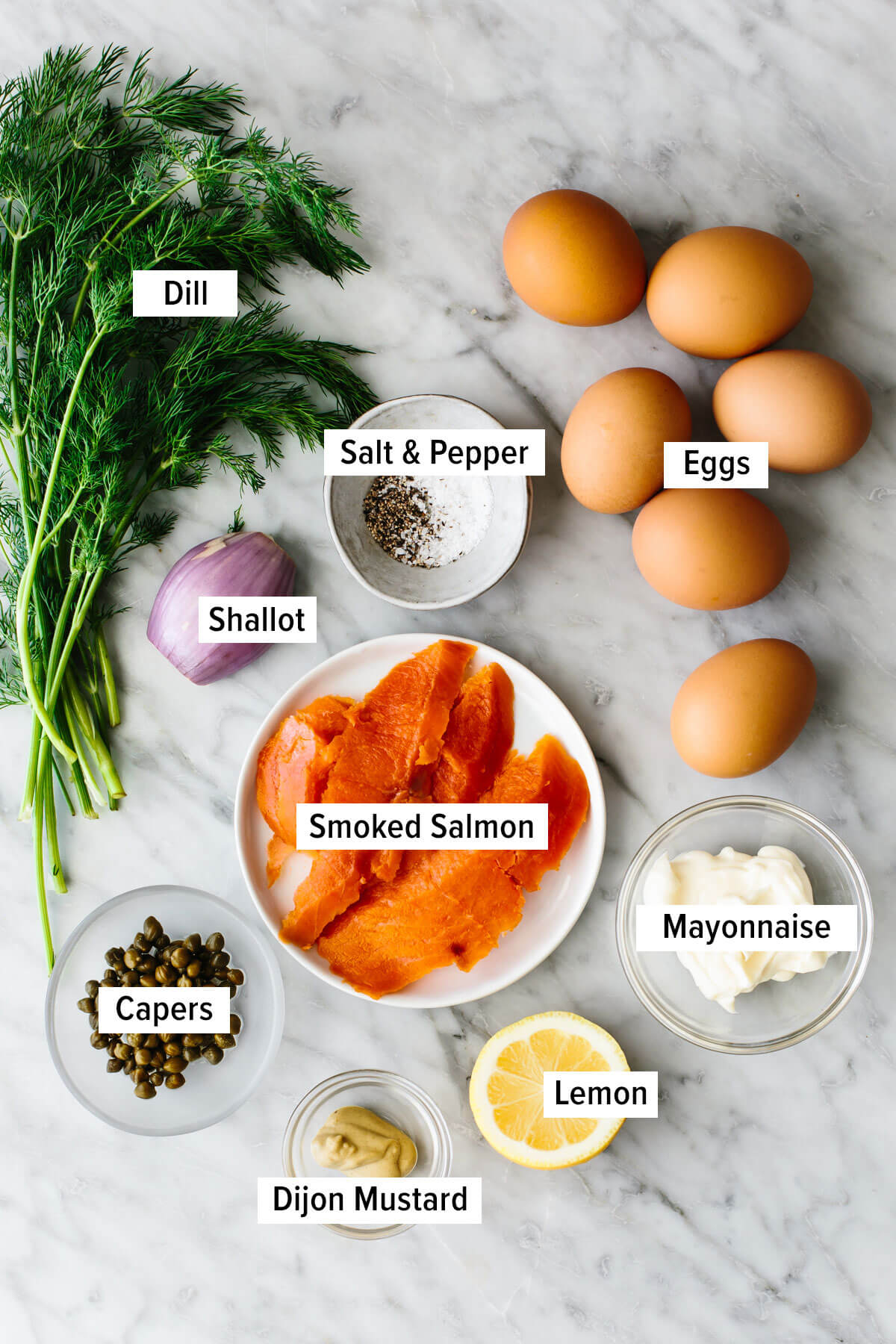 Ingredients for smoked salmon deviled eggs on a table.