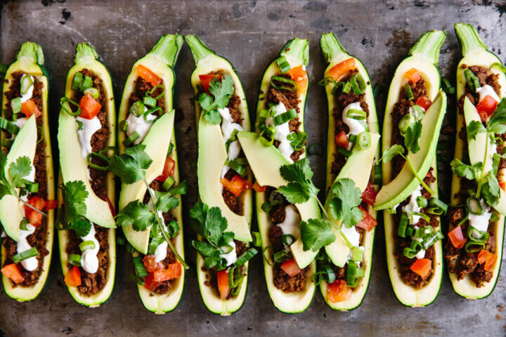 Taco stuffed zucchini boats fresh out of the oven and ready to be served.