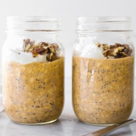 Two jars of pumpkin pie overnight oats.