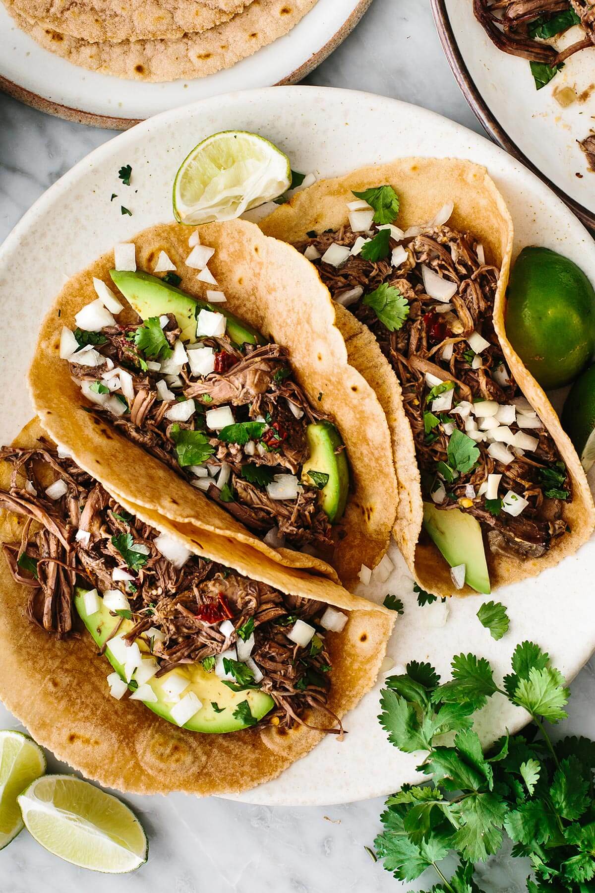 Slow cooker recipe featuring barbacoa tacos.