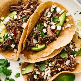 Slow cooker recipe featuring barbacoa tacos.