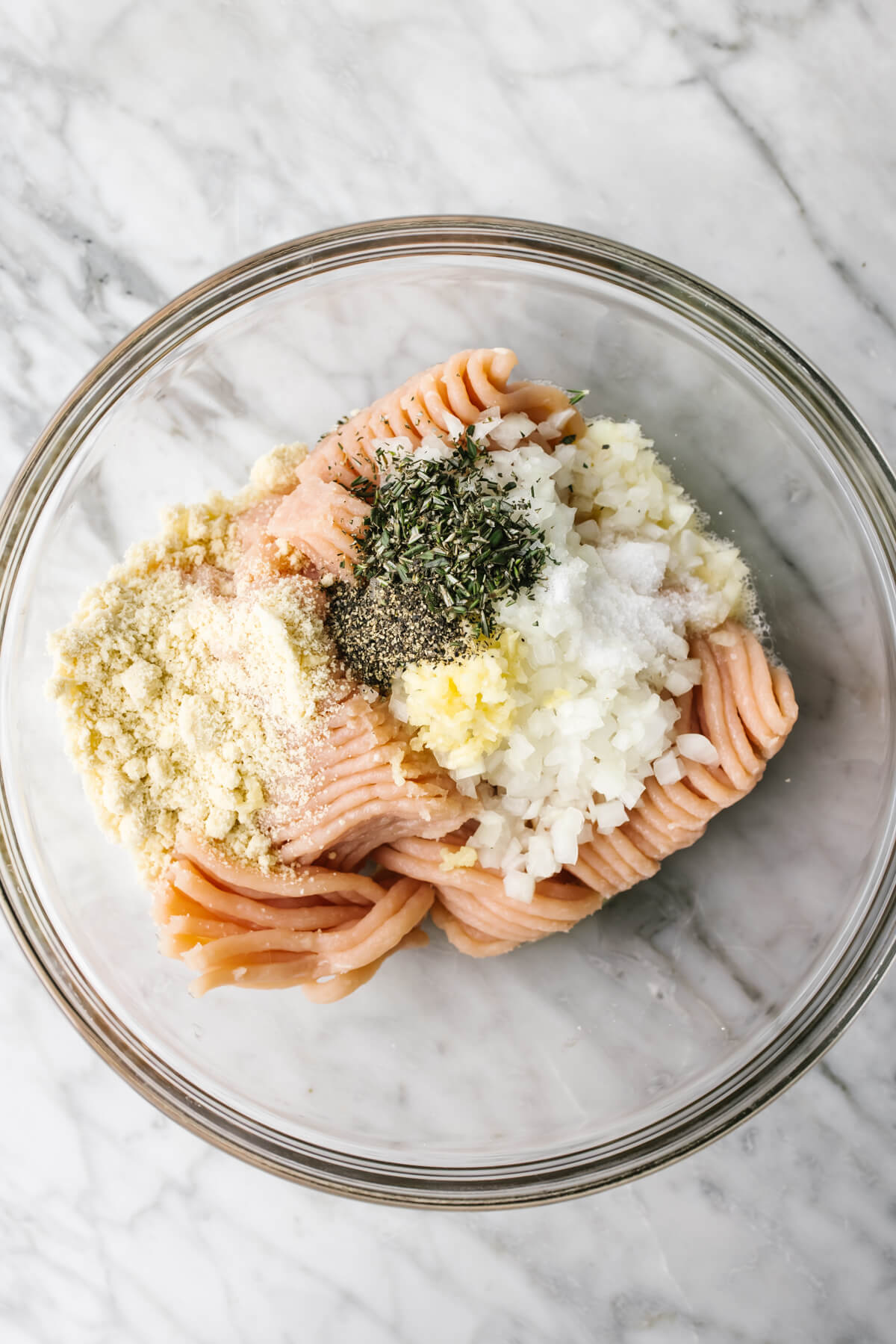 Turkey meatball ingredients in a glass bowl