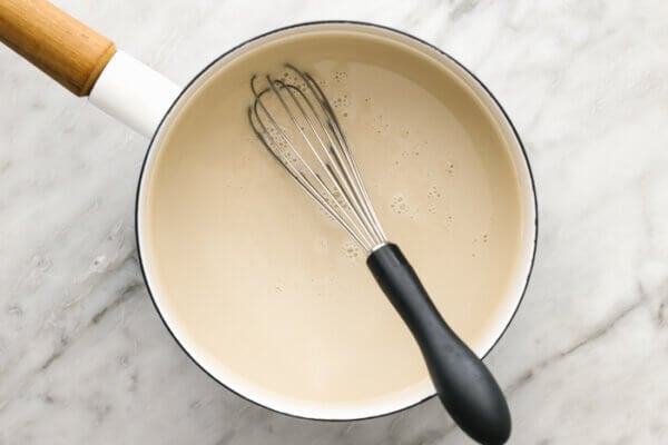 Coconut crème brûlée mixture in a pot.
