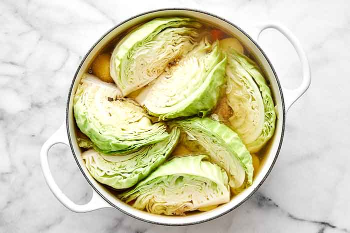 Step three of corned beef and cabbage: Add the cabbage.
