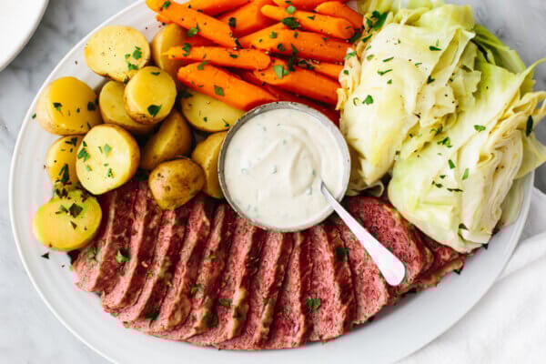A large platter of corned beef and cabbage