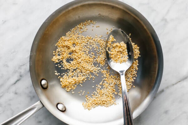 Toasted sesame seeds in a pan for za'atar spice