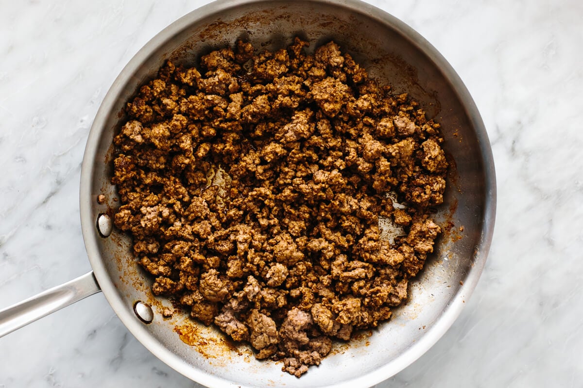 Cooking ground beef in a pan for nachos