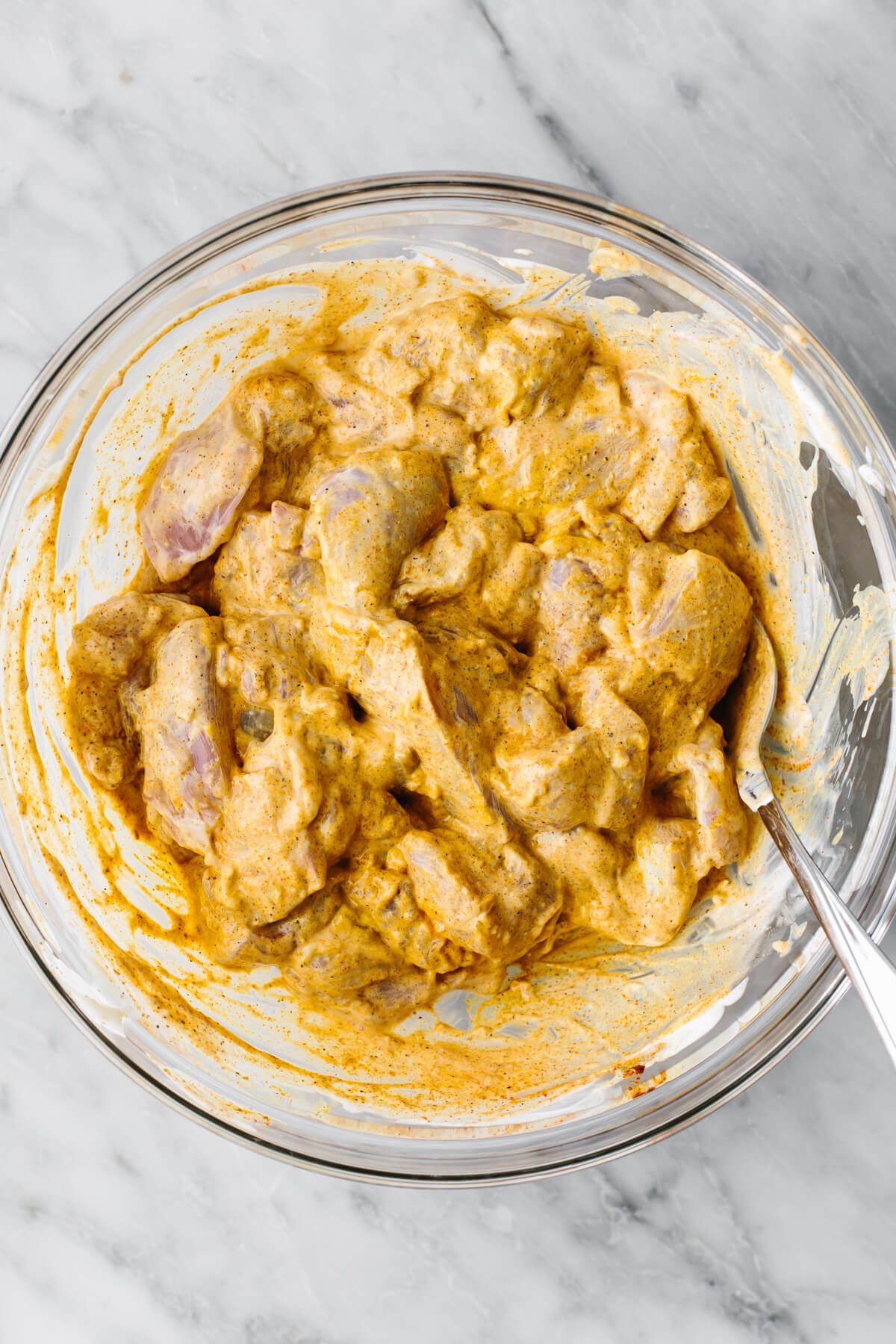 Marinating chicken in a bowl for butter chicken