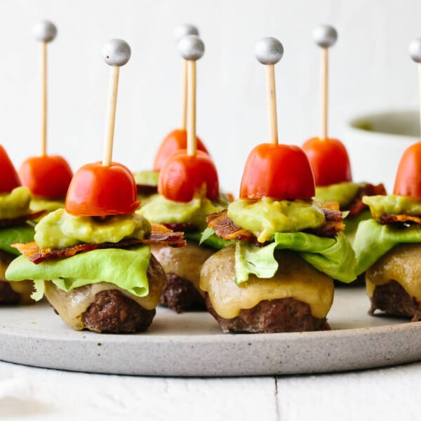 Guacamole bacon burger bites on a plate