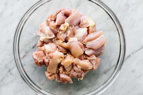 Diced chicken in a bowl for butter chicken
