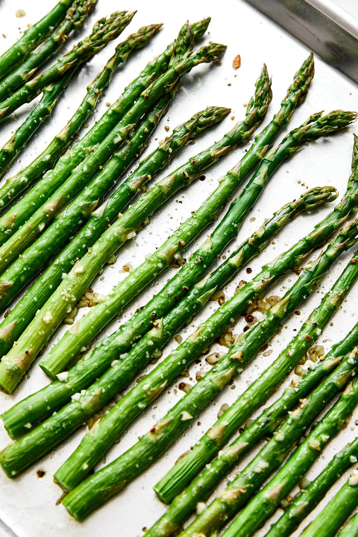 Roasted asparagus on a sheet pan.