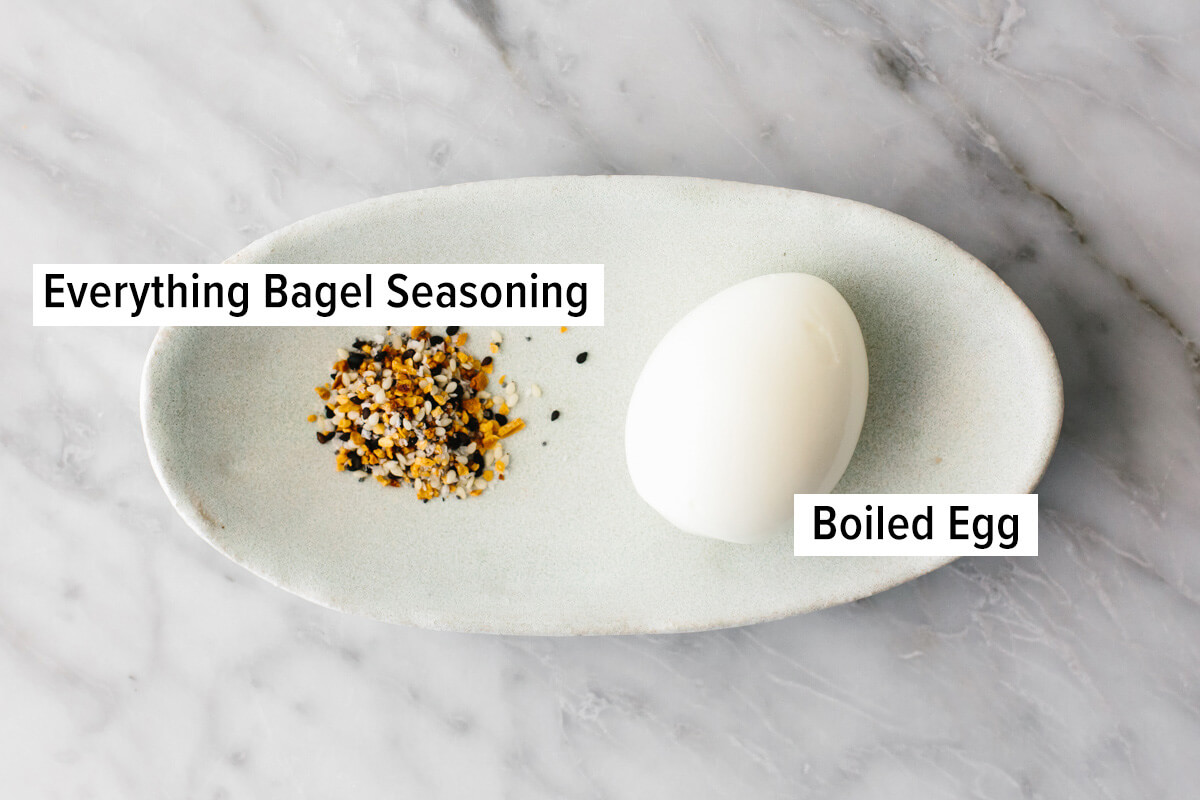 This budget meal prep shows that healthy eating doesn't have to break the bank. Turn 11 prepped ingredients into 7 meals that costs $3 or less! Hard boiled egg and bagel seasoning on a plate