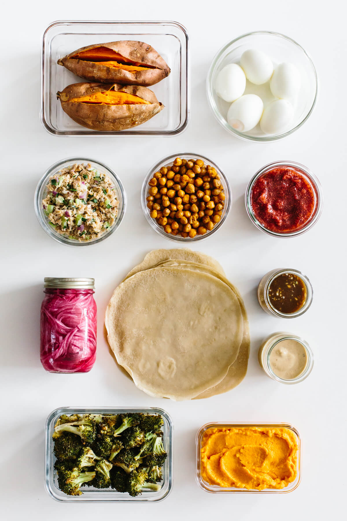 This budget meal prep shows that healthy eating doesn't have to break the bank. Turn 11 prepped ingredients into 7 meals that costs $3 or less! Ingredients on table for a budget meal prep
