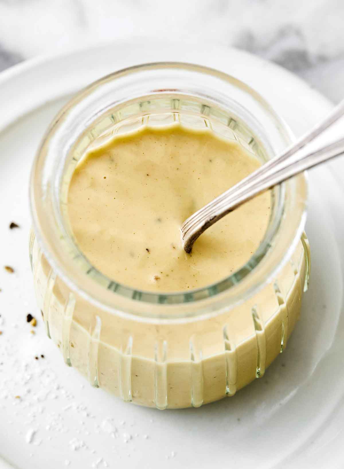 A jar of maple mustard tahini dressing.