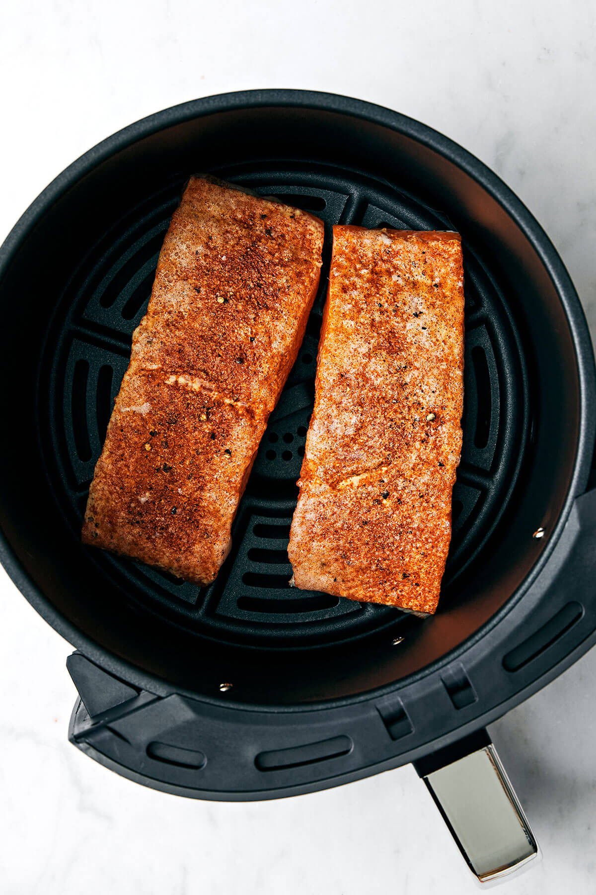 This air fryer salmon recipe is the secret to a moist and crispy filet that tastes like a million bucks - in under 15 minutes! Salmon in air fryer.