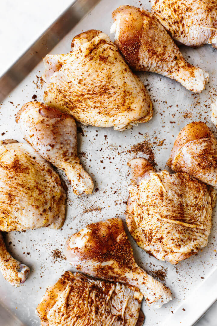 BBQ chicken on a sheet pan before grilling