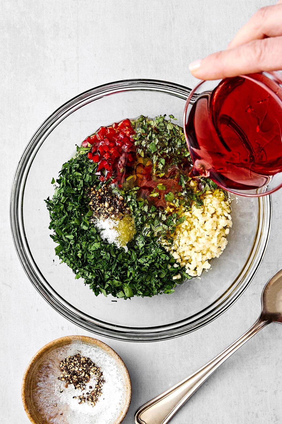Chimichurri sauce ingredients in a bowl.