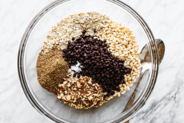 A glass bowl of granola bar ingredients