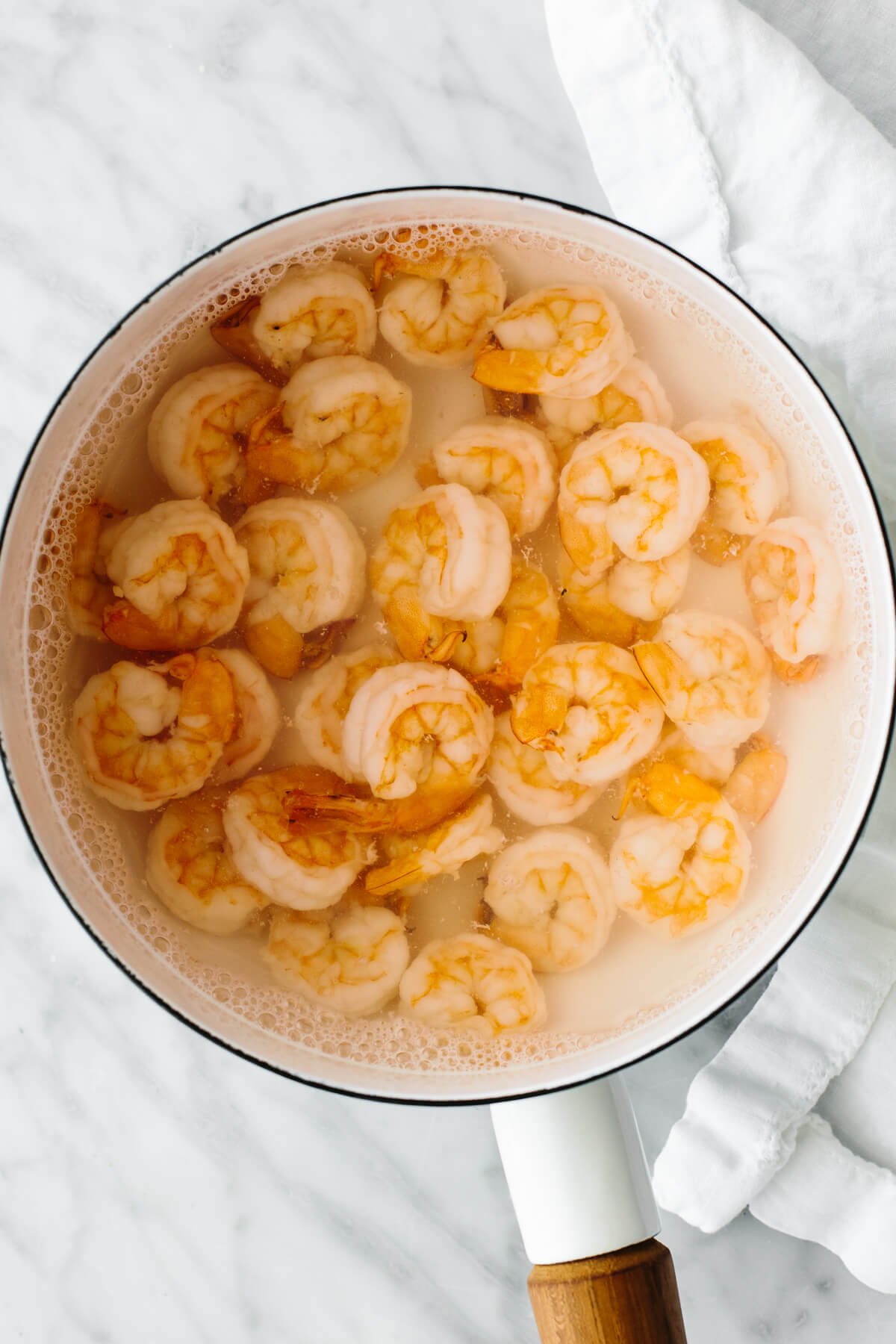 This cucumber shrimp salad is everything you love about an easy and healthy salad recipe, but with a fresh twist! Boiling shrimp in a pot for cucumber shrimp salad