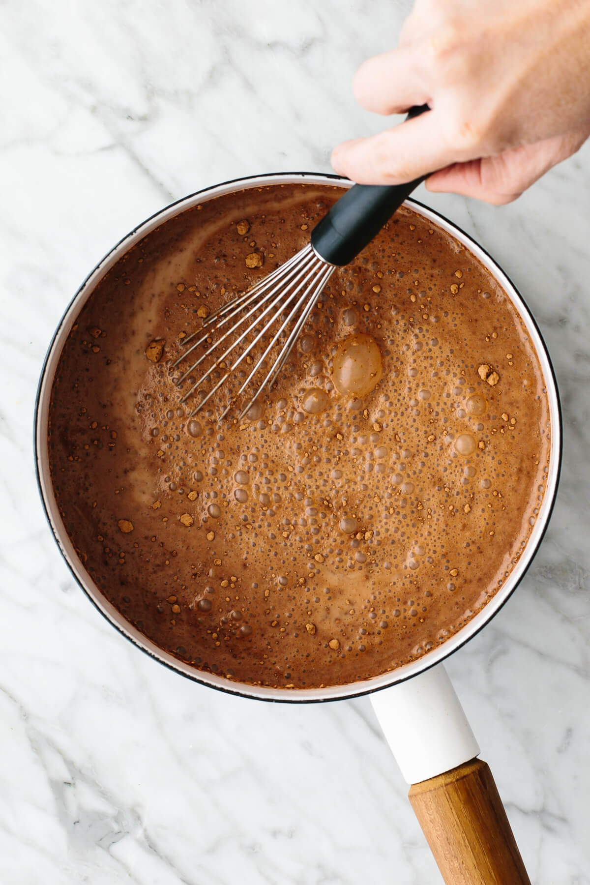 This is the best hot chocolate you'll ever taste! It's unbelievably rich, velvety smooth, and perfect for warming up through winter and Christmas. Making hot chocolate in a pot.