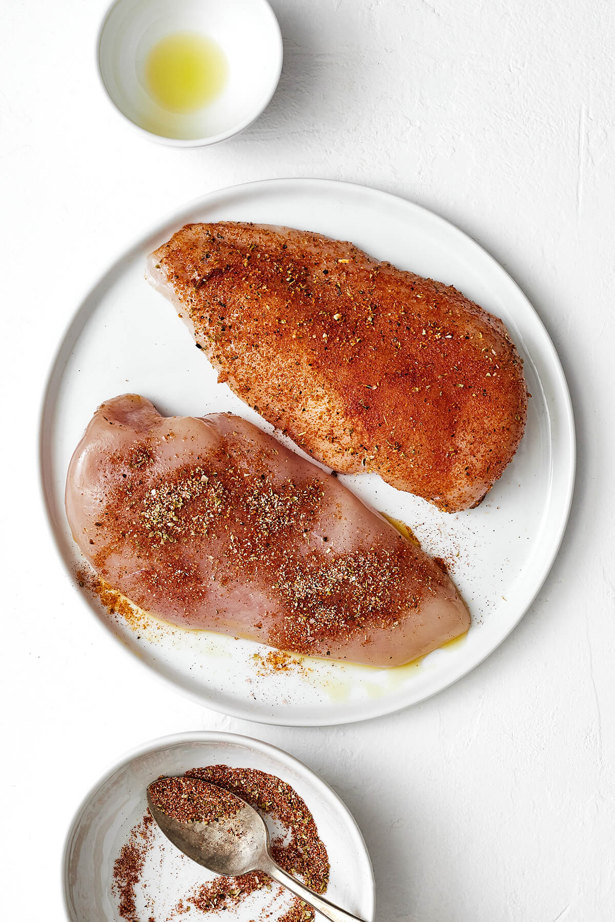 This easy air fryer chicken breast recipe is a healthy dinner essential with results that are incredibly tender, juicy, and delicious! Seasoning chicken breasts before adding to air fryer