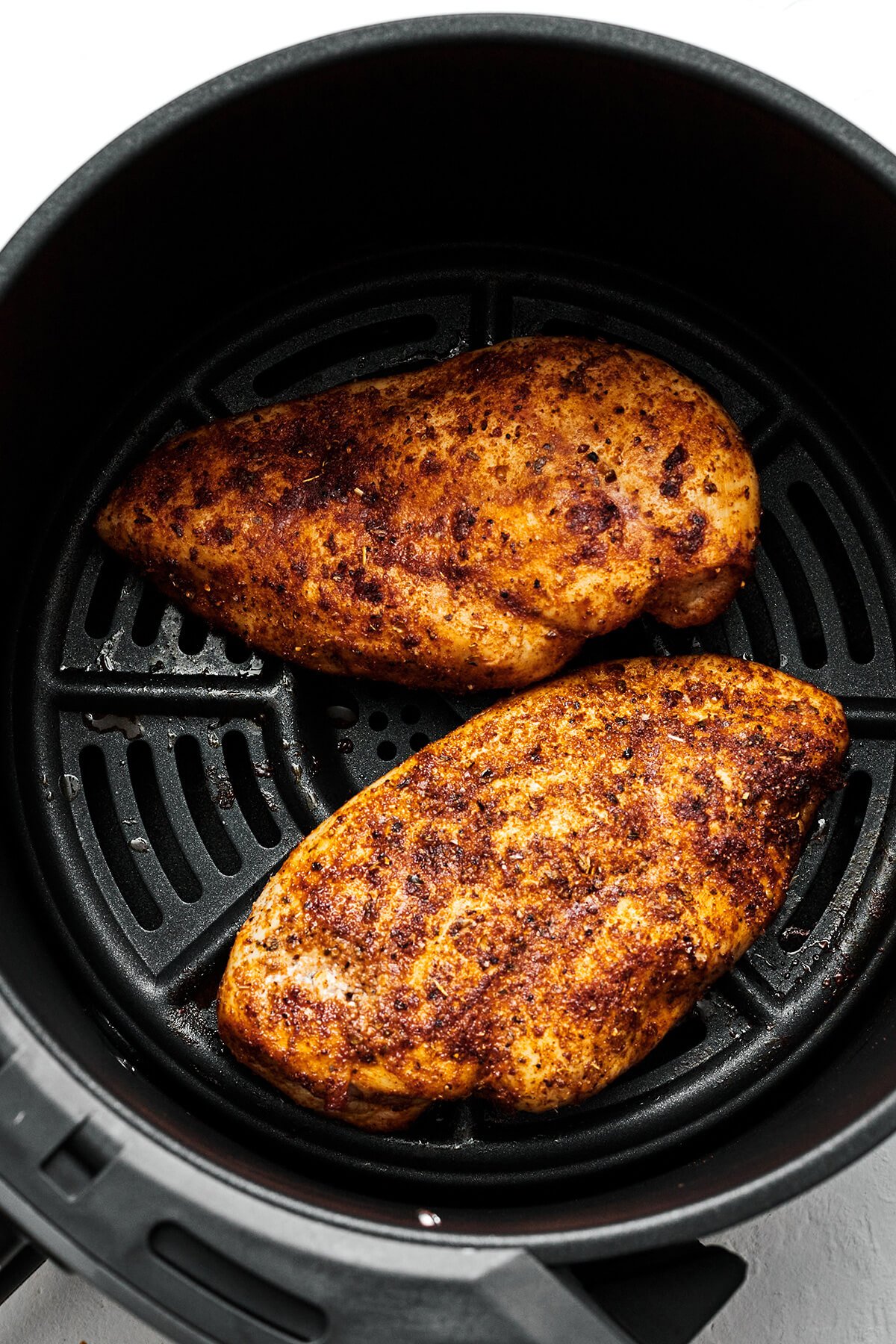 This easy air fryer chicken breast recipe is a healthy dinner essential with results that are incredibly tender, juicy, and delicious! Chicken breasts in air fryer