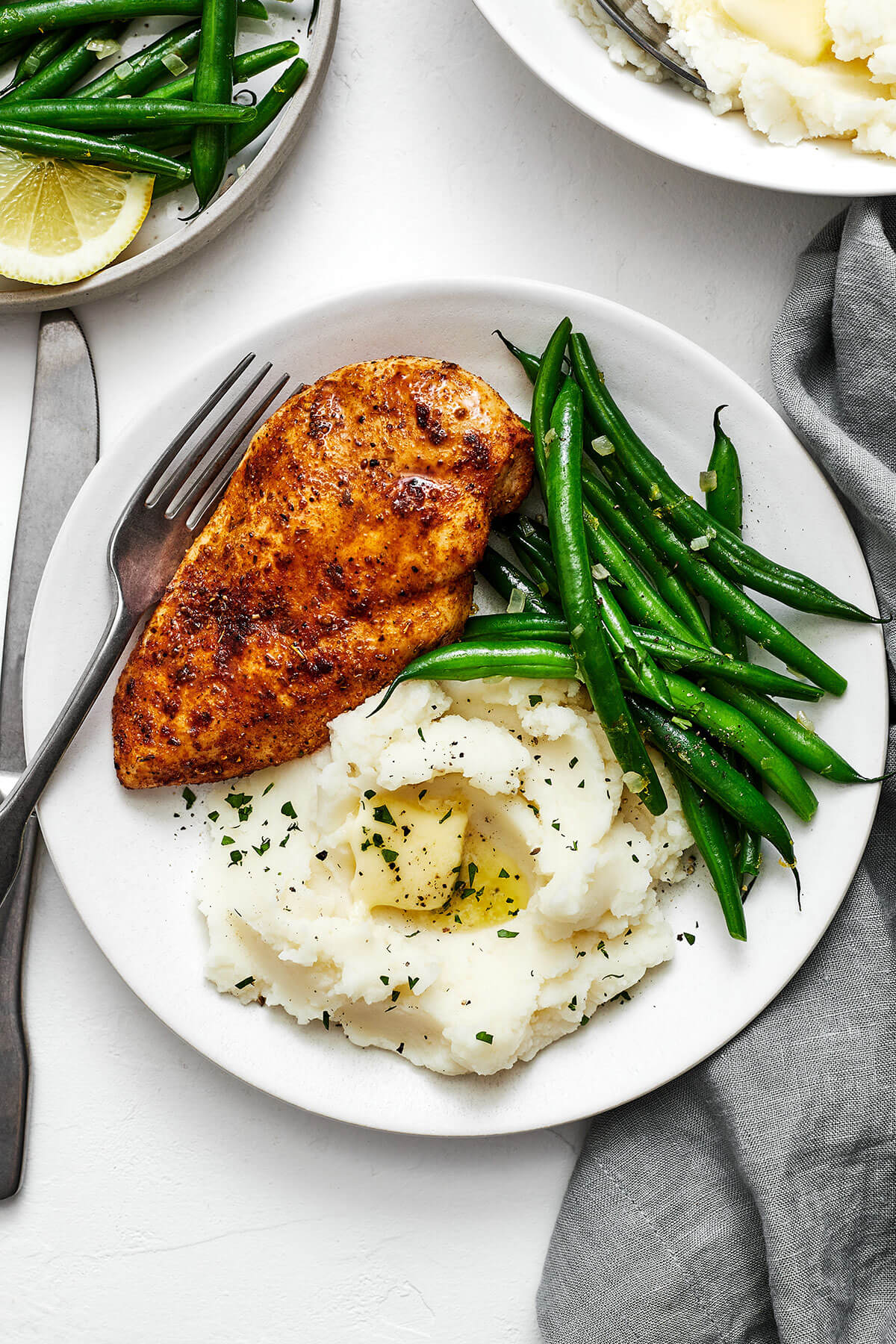 This easy air fryer chicken breast recipe is a healthy dinner essential with results that are incredibly tender, juicy, and delicious! A plate with air fryer chicken breasts and mashed potatoes