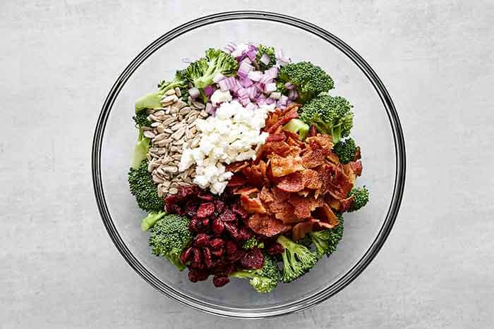 Broccoli salad in a glass bowl.