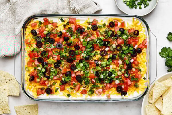 7 layer dip next to tortilla chips
