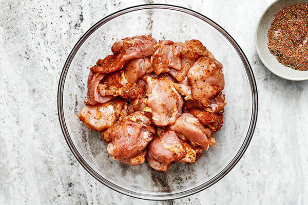 Seasoning chicken for jambalaya