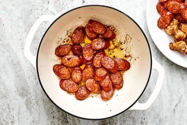 Sauteing sausage in a pot for jambalaya
