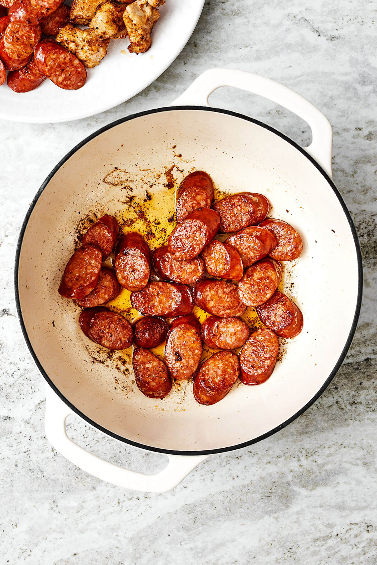 Cooking sausage in a pot for jambalaya