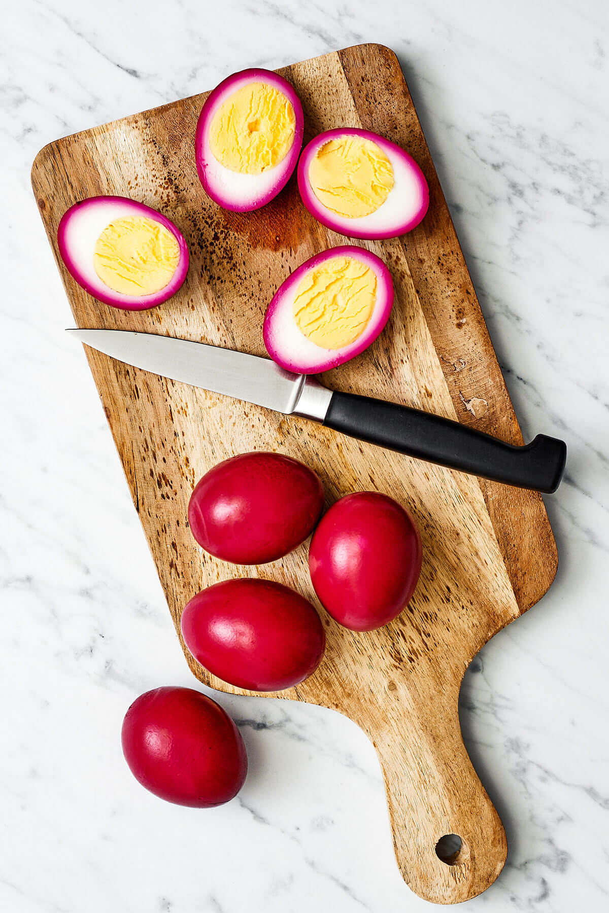 Slicing beet pickled deviled eggs