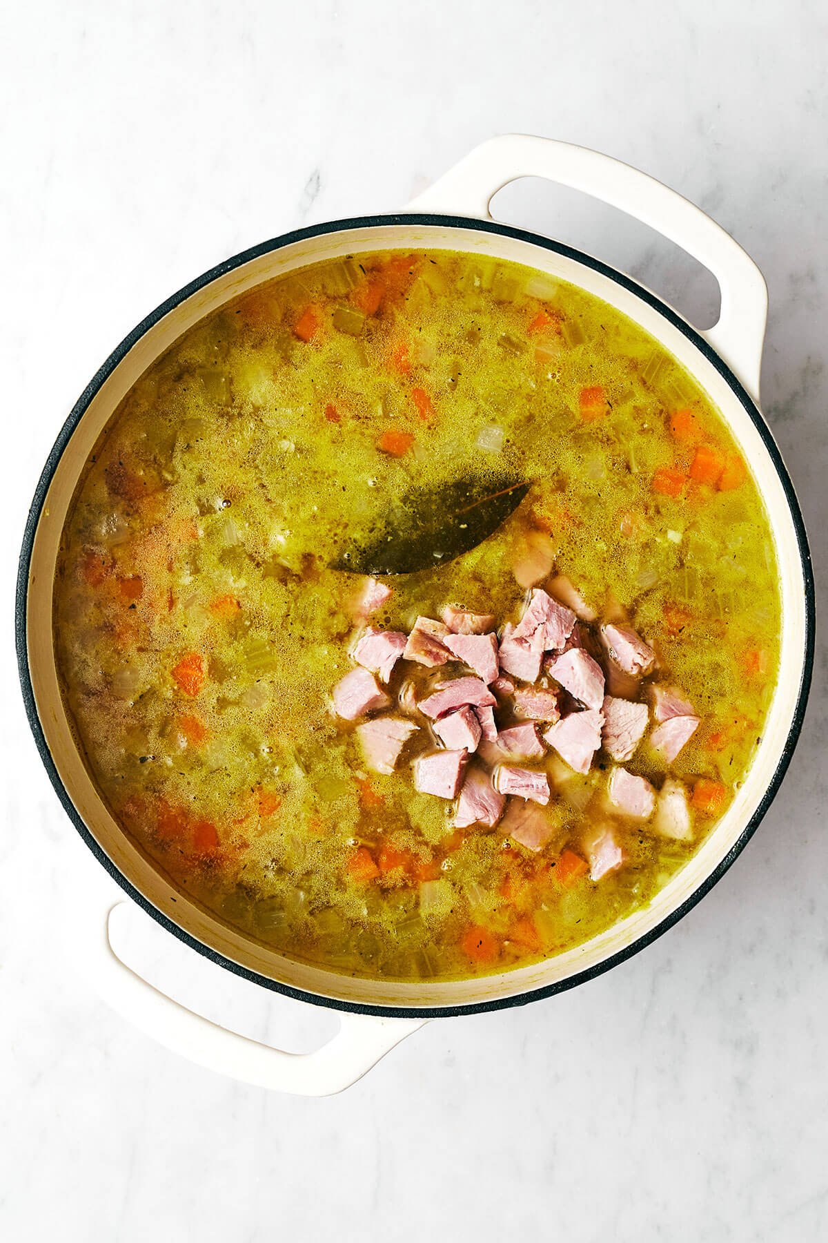 This split pea soup made with a ham bone is the best leftover ham recipe from the holidays! Making split pea soup in a pot