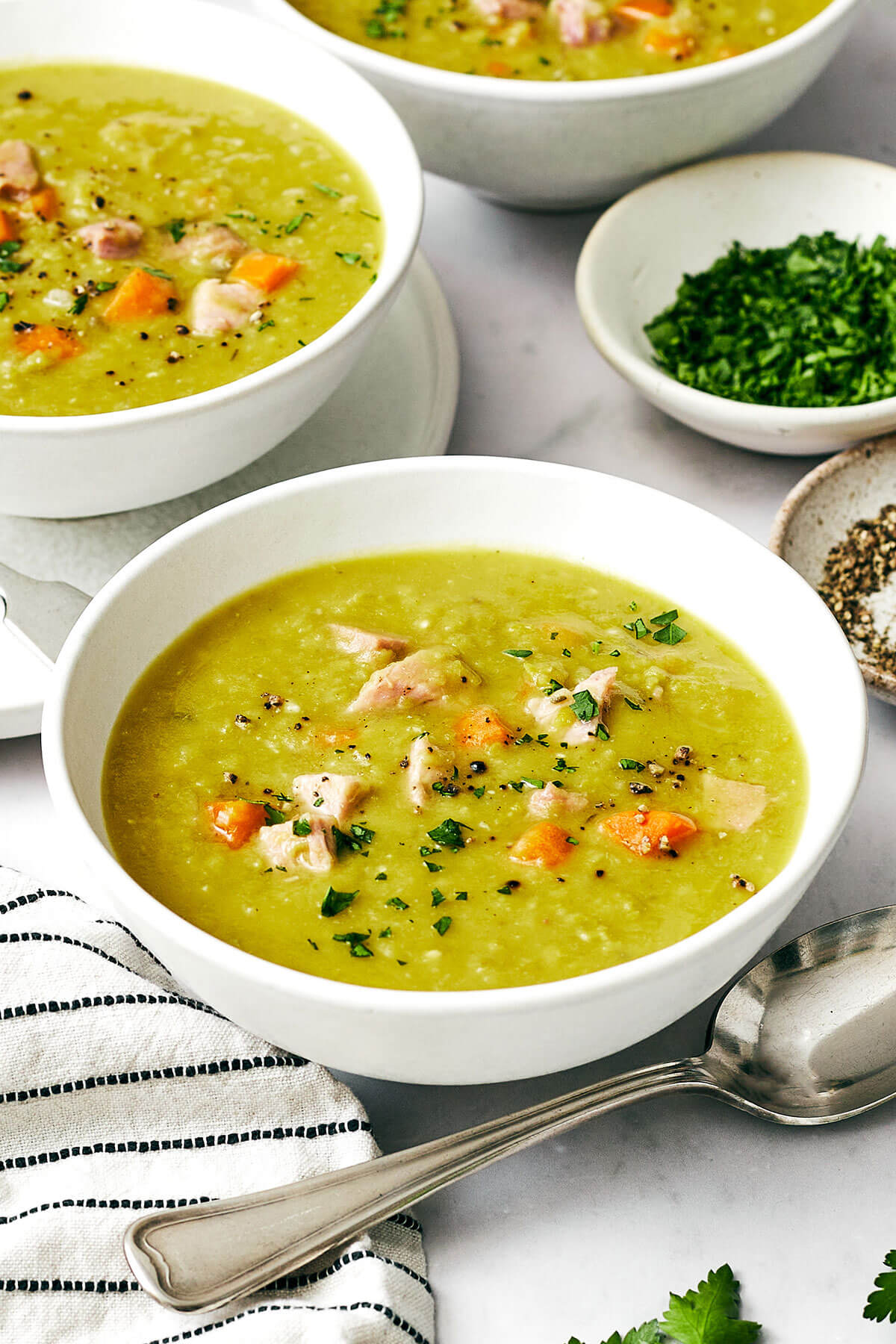This split pea soup made with a ham bone is the best leftover ham recipe from the holidays! A few bowls of split pea soup