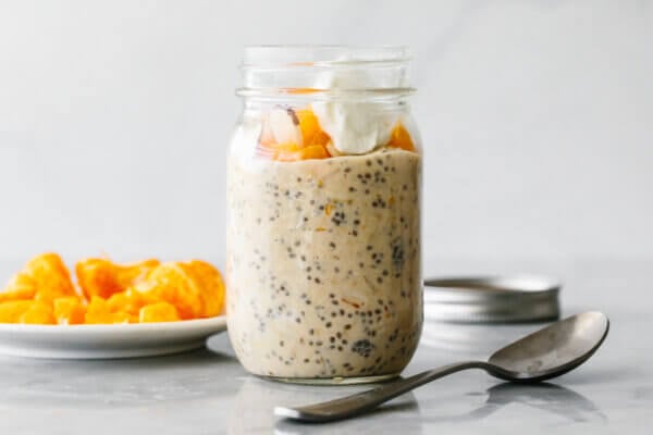 A jar of orange overnight oats