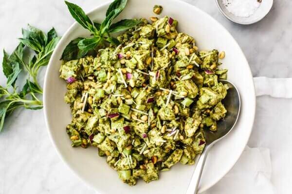 A bowl of mixed pesto chicken salad