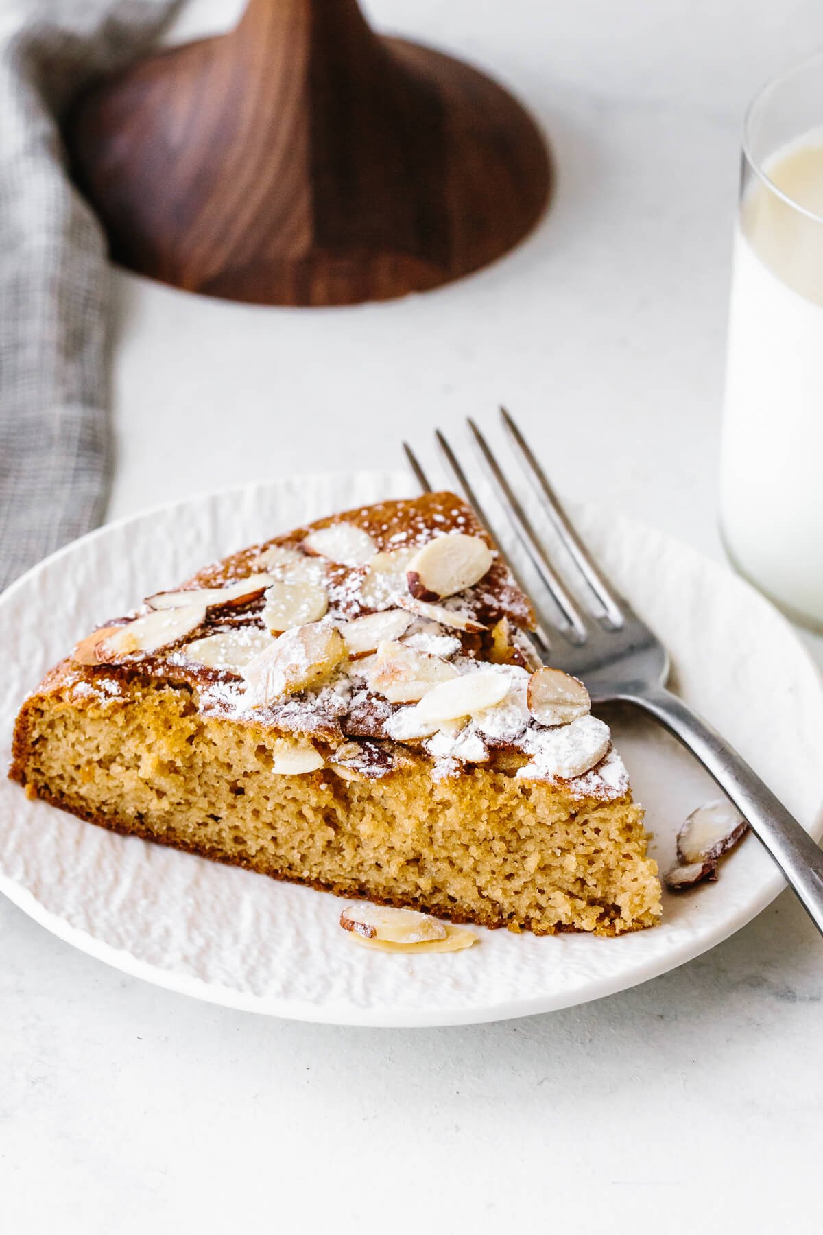 A slice of almond cake on a plate
