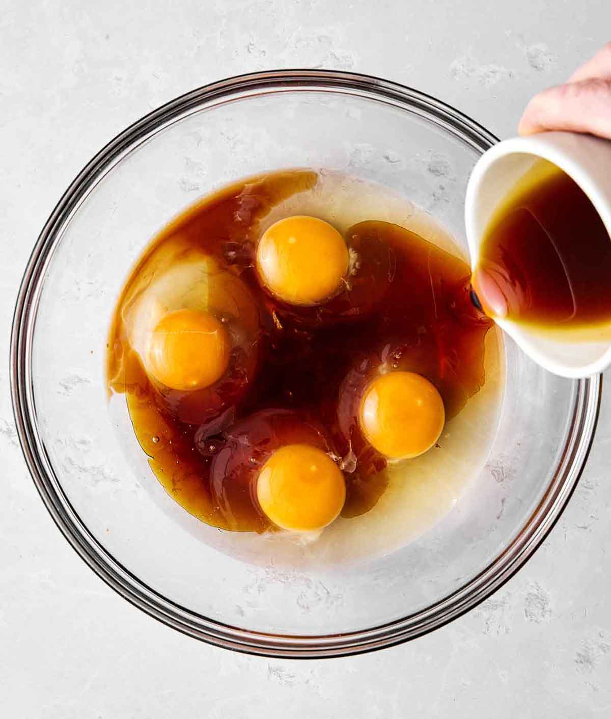 This almond cake is the perfect dessert for any occasion. Serve it plain for afternoon tea or top it with cream and fruit for the holidays! Step two of almond cake: whisk wet ingredients.