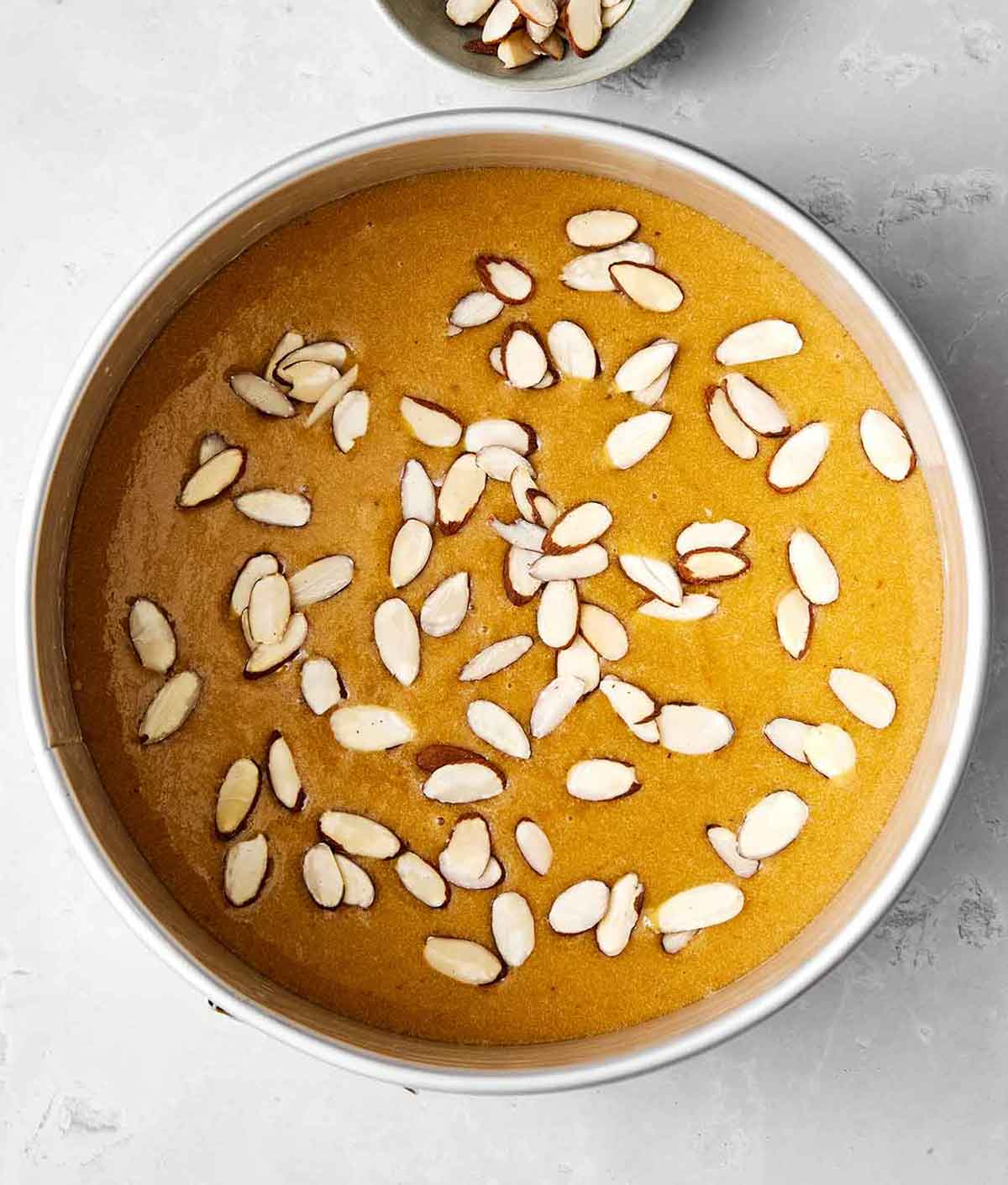 This almond cake is the perfect dessert for any occasion. Serve it plain for afternoon tea or top it with cream and fruit for the holidays! Step three of almond cake: mix together.