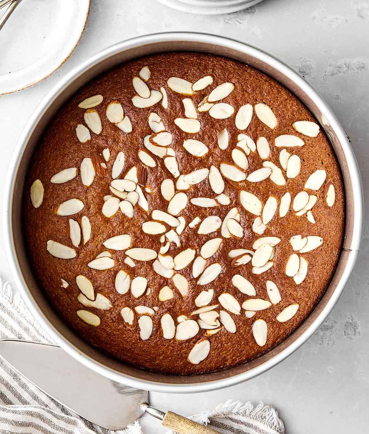 This almond cake is the perfect dessert for any occasion. Serve it plain for afternoon tea or top it with cream and fruit for the holidays! Step four of almond cake: bake the cake.