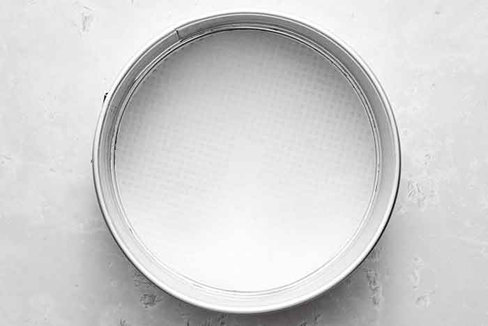 Prepare cake pan for almond cake.